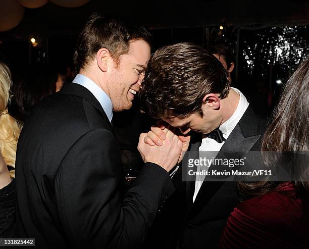 Michael C. Hall and Andrew Garfield attend the 2011 Vanity Fair Oscar Party Hosted by Graydon Carter at the Sunset Tower Hotel on February 27, 2011...