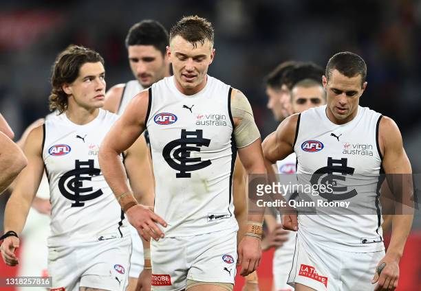 Patrick Cripps and his Blues team mates look dejected after losing the round 9 AFL match between the Melbourne Demons and the Carlton Blues at...