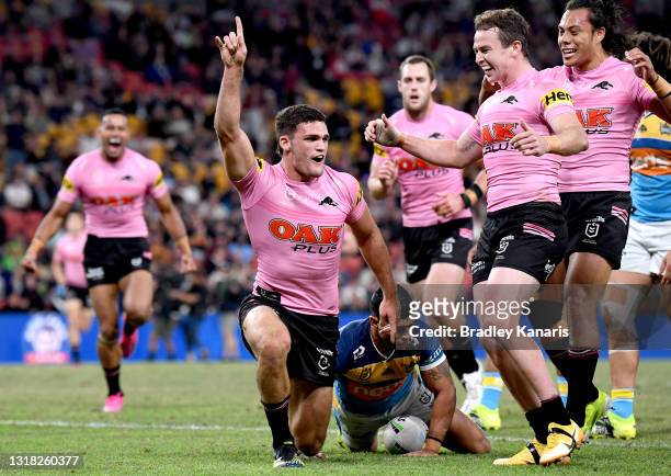 Nathan Cleary of the Panthers celebrates scoring a try during the round 10 NRL match between the Gold Coast Titans and the Penrith Panthers at...