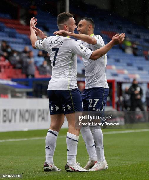 John McGinn of Aston Villa celebrates after scoring their team's first goal with Ahmed Elmohamady during the Premier League match between Crystal...