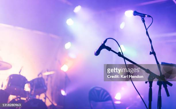 an illuminated concert stage - stock photo - gig stockfoto's en -beelden