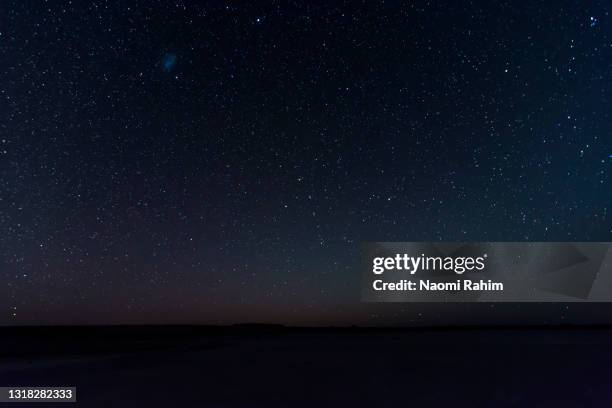 stars shining in a dark night sky - star space stock pictures, royalty-free photos & images