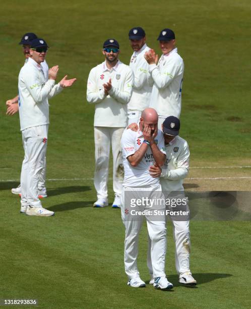Durham bowler Chris Rushworth is congratulated by Captain Scott Borthwick and team mates after taking the wicket of Worcestershire batsman Jack...