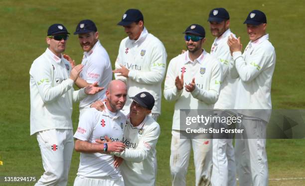 Durham bowler Chris Rushworth is congratulated by Captain Scott Borthwick and team mates after taking the wicket of Worcestershire batsman Jack...