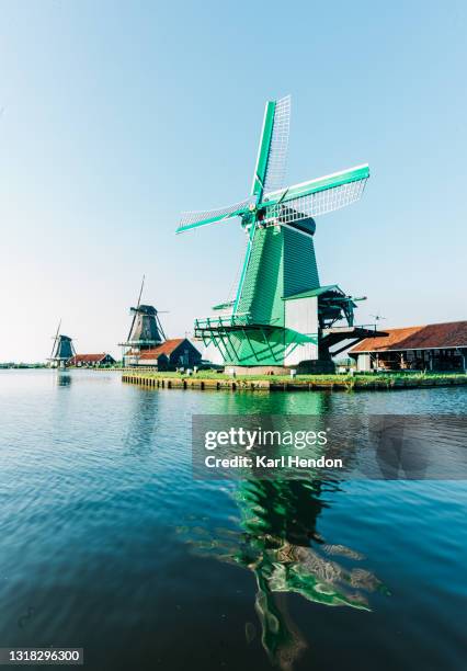 a dutch windmill on a bright day - stock photo - zaanse schans stock-fotos und bilder