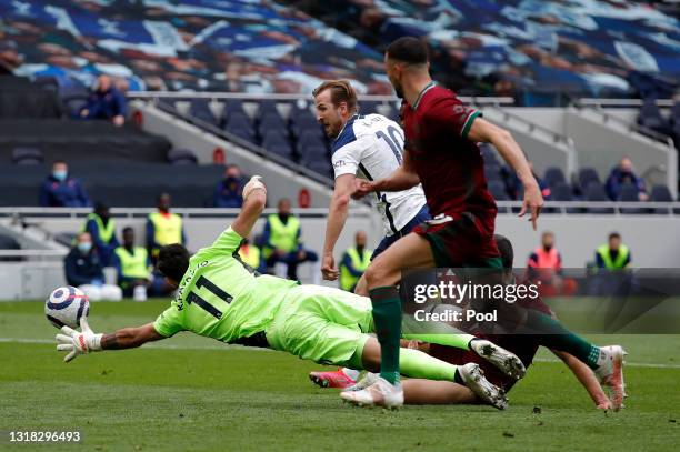 Harry Kane of Tottenham Hotspur scores their side's first goal past Rui Patricio of Wolverhampton Wanderers during the Premier League match between...