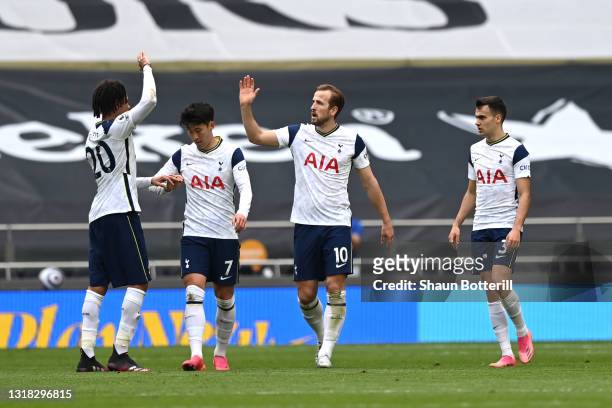 Harry Kane of Tottenham Hotspur celebrates with team mates Dele Alli, Son Heung-Min and Sergio Reguilon after scoring their side's first goal during...