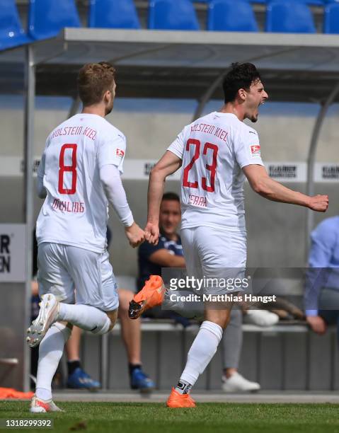 Janni Serra of Holstein Kiel celebrates after scoring their team's first goal during the Second Bundesliga match between Karlsruher SC and Holstein...
