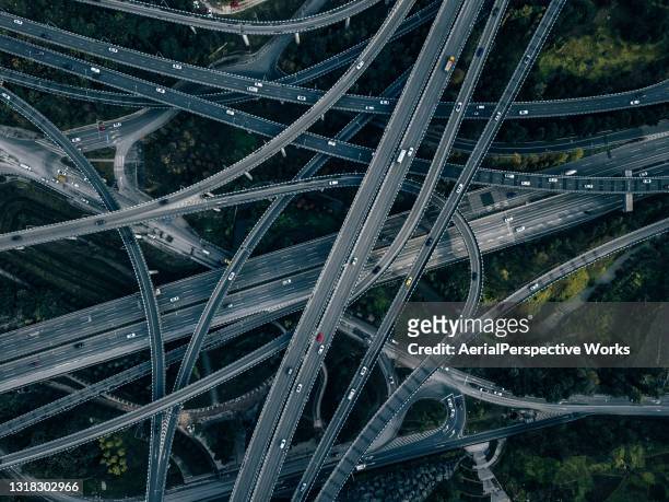 aerial view of complex overpass and busy traffic - transportation imagens e fotografias de stock