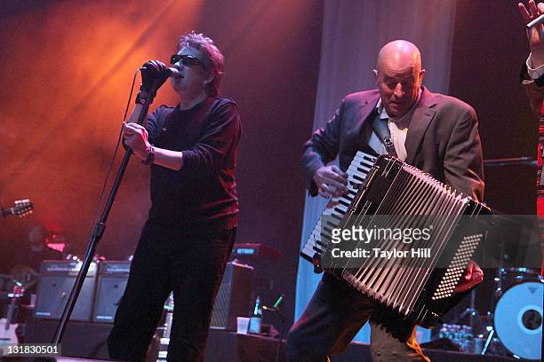 Shane MacGowan and James Fearnley of The Pogues perform at Terminal 5 on March 15, 2011 in New York City.