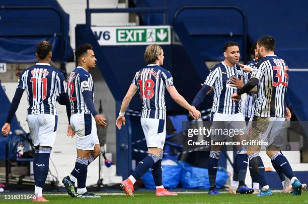 Hal Robson-Kanu of West Bromwich Albion celebrates with team mates after scoring their side's first goal during the Premier League match between West...