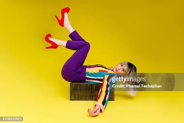fashionable young woman in colorful outfit - fashion high heels stock pictures, royalty-free photos & images