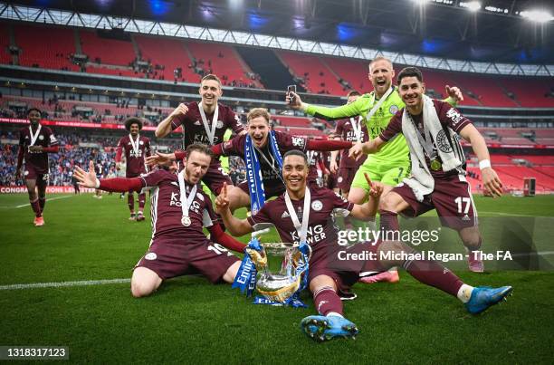 Leicester City players celebrate with the Emirates FA Cup trophy following The Emirates FA Cup Final match between Chelsea and Leicester City at...