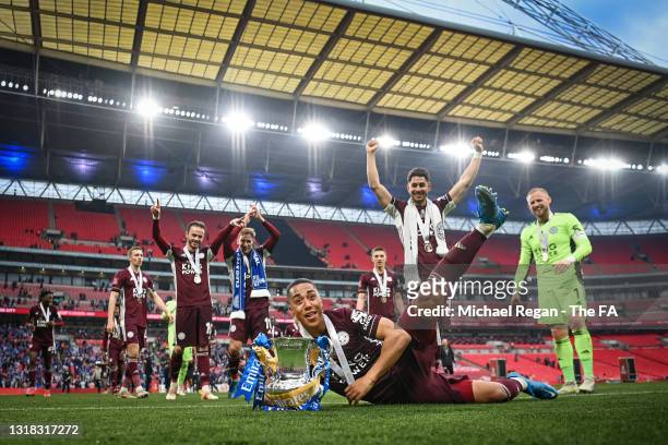 Youri Tielemans and Leicester City players celebrate with the Emirates FA Cup trophy following The Emirates FA Cup Final match between Chelsea and...