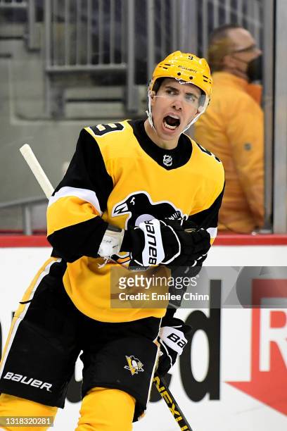 Evan Rodrigues of the Pittsburgh Penguins celebrates a goal against the New York Islanders in the first period in Game One of the First Round of the...