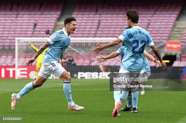 Santi Mina of Celta Vigo celebrates after scoring their team's first goal with Brais Mendez of Celta Vigo during the La Liga Santander match between...