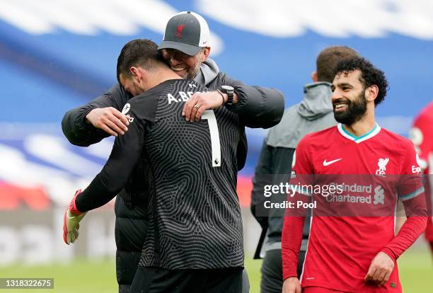 Jurgen Klopp, Manager of Liverpool celebrates victory with Alisson of Liverpool following the Premier League match between West Bromwich Albion and...