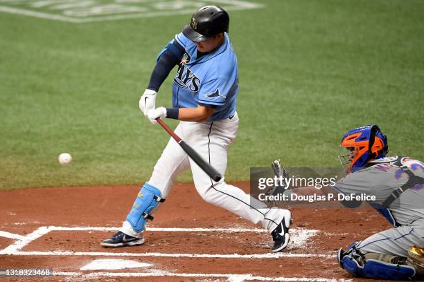 Ji-Man Choi of the Tampa Bay Rays hits a single during the first inning against the New York Mets at Tropicana Field on May 16, 2021 in St...