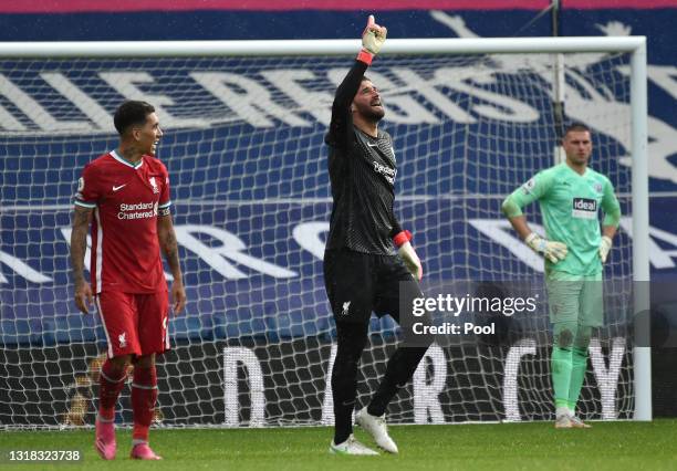 Alisson of Liverpool celebrates after scoring their side's second goal during the Premier League match between West Bromwich Albion and Liverpool at...