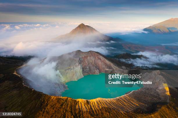 aerial view of misty volcano of kawah ijen crater in east java - java foto e immagini stock