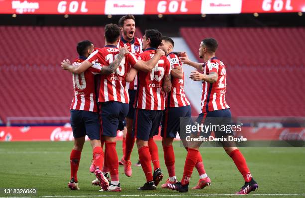 Stefan Savic of Atletico Madrid celebrates a goal with Sauel Niguez, Felipe, Yannick Ferreira Carrasco and Angel Correa which was later disallowed by...