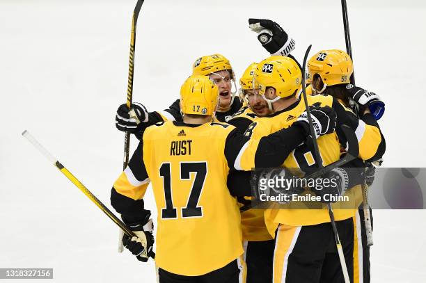 The Pittsburgh Penguins celebrate a goal by Sidney Crosby during the second period in Game One of the First Round of the 2021 Stanley Cup Playoffs...