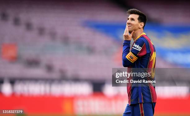 Lionel Messi of FC Barcelona looks on during the La Liga Santander match between FC Barcelona and RC Celta at Camp Nou on May 16, 2021 in Barcelona,...