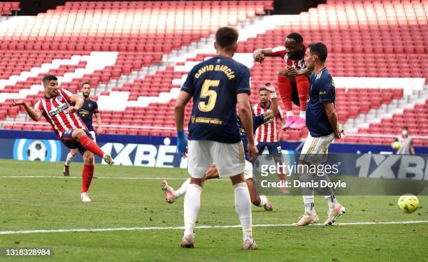 Luis Suarez of Atletico Madrid scores their team's second goal during the La Liga Santander match between Atletico de Madrid and C.A. Osasuna at...