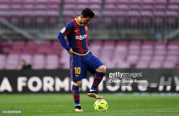 Lionel Messi of FC Barcelona looks dejected during the La Liga Santander match between FC Barcelona and RC Celta at Camp Nou on May 16, 2021 in...