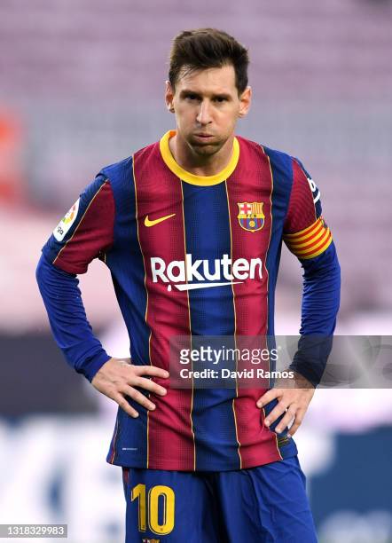Lionel Messi of FC Barcelona looks dejected during the La Liga Santander match between FC Barcelona and RC Celta at Camp Nou on May 16, 2021 in...