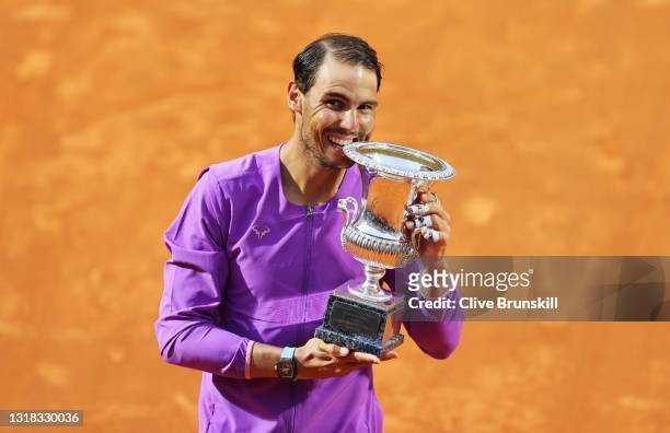 Rafael Nadal of Spain celebrates with the trophy after winning the final over Novak Djokovic of Serbia during the men's final at Foro Italico on May...