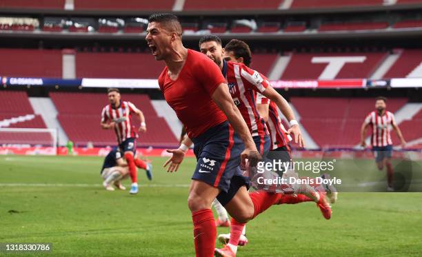 Luis Suarez of Atletico Madrid celebrates after scoring their team's second goal during the La Liga Santander match between Atletico de Madrid and...