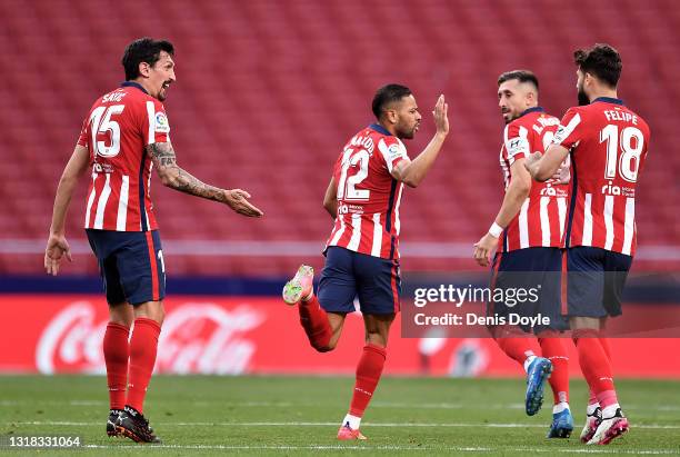 Renan Lodi of Atletico Madrid celebrates after scoring their team's first goal with Stefan Savic, Felipe and Hector Herrera during the La Liga...