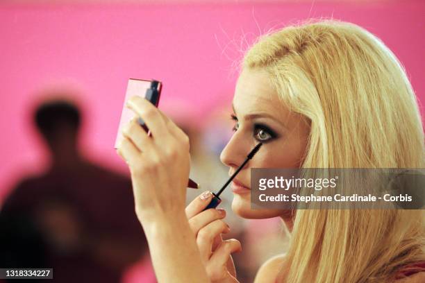 Top model Karen Mulder does her make up backstage during the Christian Lacroix Ready to Wear Spring/Summer 1996 show as part of Paris Fashion Week on...