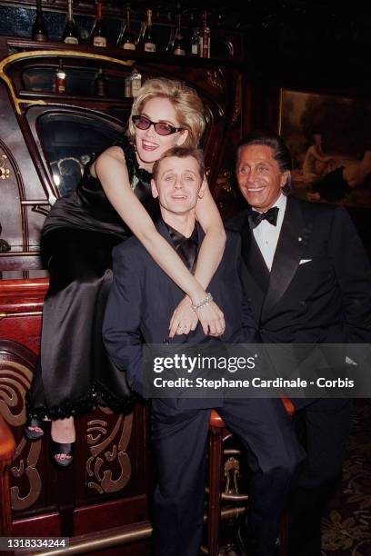Actress Sharon Stone, dancer Mikhail Baryshnikov and Fashion designer Valentino attend Valentino Party at Maxim’s restaurant on October 25, 1995 in...