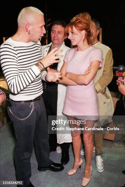 Fashion designer Jean Paul Gaultier and singer Mylene Farmer pose backstage during the Jean Paul Gaultier Ready to Wear Spring/Summer 1996 show as...