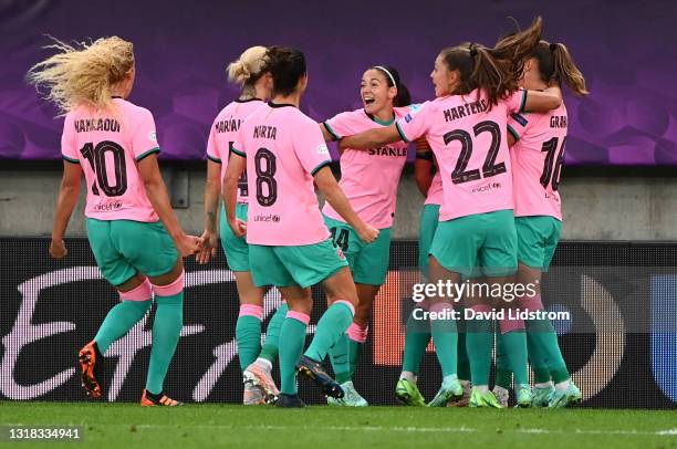 Alexia Putellas of FC Barcelona celebrates with team mates after scoring their side's second goal from the penalty spot during the UEFA Women's...