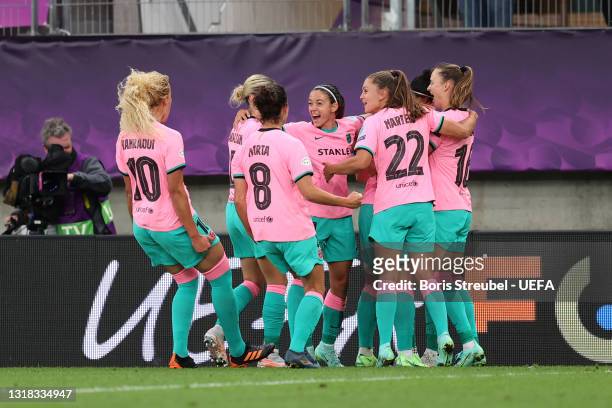 Alexia Putellas of FC Barcelona celebrates with team mates after scoring their side's second goal from the penalty spot during the UEFA Women's...