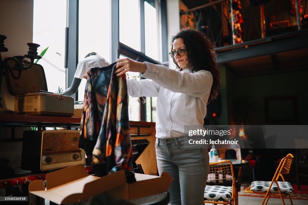 Clothes Packing In Store Female Owner Of A Small Fashion Shop Packing Clothing High-Res Stock ...
