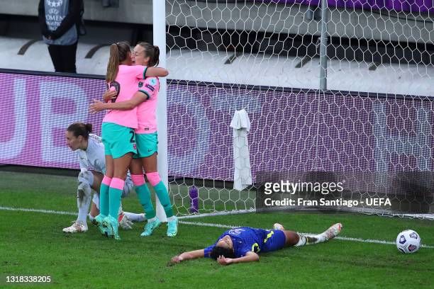 Caroline Graham Hansen of FC Barcelona celebrates with team mate Lieke Martens after scoring their side's fourth goal as Jess Carter of Chelsea looks...