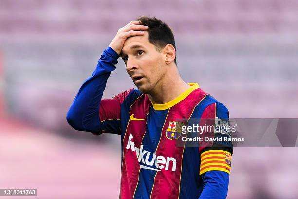 Lionel Messi of FC Barcelona shows his dejection during the La Liga Santander match between FC Barcelona and RC Celta at Camp Nou on May 16, 2021 in...