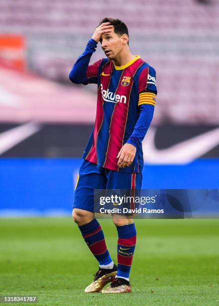 Lionel Messi of FC Barcelona shows his dejection during the La Liga Santander match between FC Barcelona and RC Celta at Camp Nou on May 16, 2021 in...