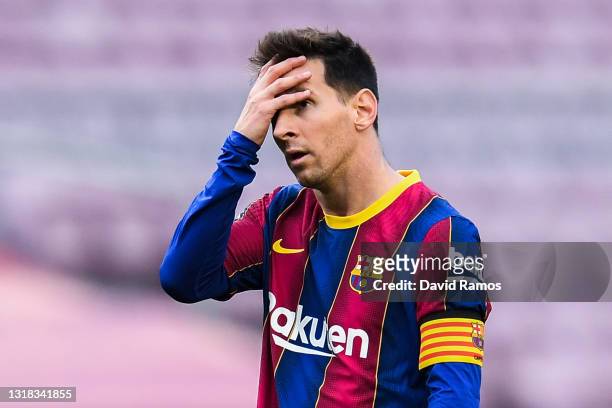 Lionel Messi of FC Barcelona shows his dejection during the La Liga Santander match between FC Barcelona and RC Celta at Camp Nou on May 16, 2021 in...