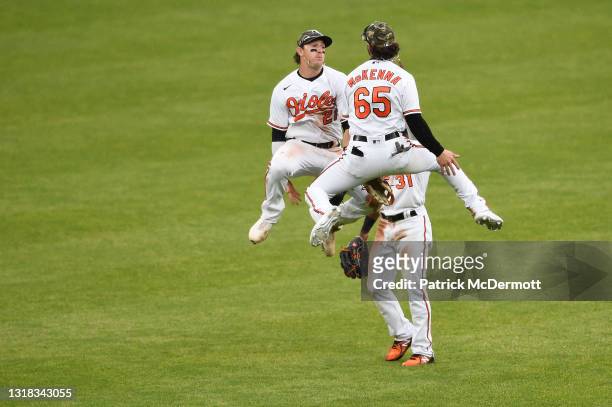 Cedric Mullins of the Baltimore Orioles celebrates with his teammates Austin Hays and Ryan McKenna after the Orioles defeated the New York Yankees...