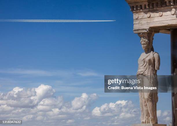 greece. athens. a caryatid of the erechtheion temple. - poseidon statue stock pictures, royalty-free photos & images