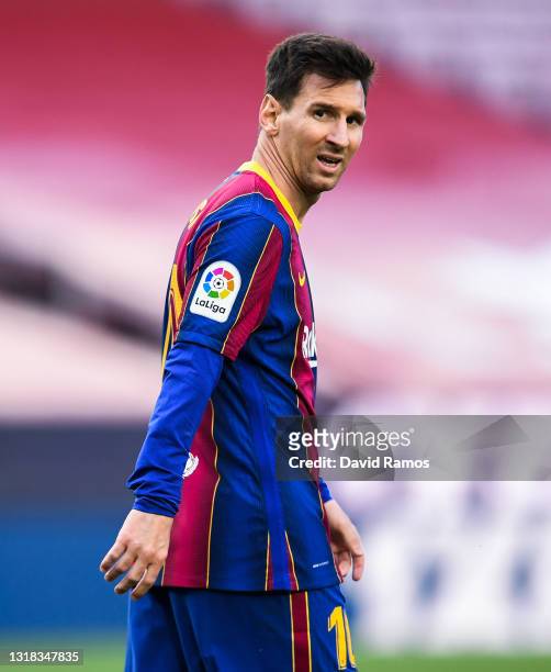 Lionel Messi of FC Barcelona looks on during the La Liga Santander match between FC Barcelona and RC Celta at Camp Nou on May 16, 2021 in Barcelona,...