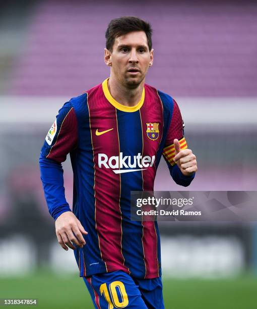 Lionel Messi of FC Barcelona looks on during the La Liga Santander match between FC Barcelona and RC Celta at Camp Nou on May 16, 2021 in Barcelona,...