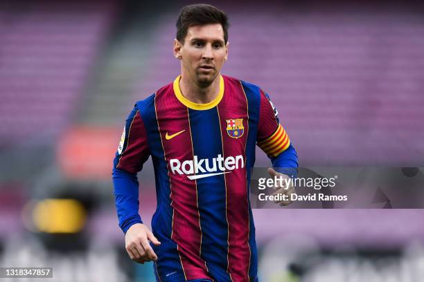 Lionel Messi of FC Barcelona looks on during the La Liga Santander match between FC Barcelona and RC Celta at Camp Nou on May 16, 2021 in Barcelona,...