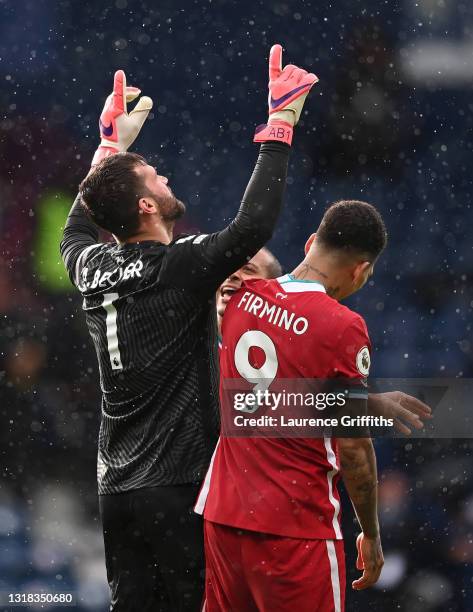Alisson Becker of Liverpool celebrates scoring the winning goal during the Premier League match between West Bromwich Albion and Liverpool at The...