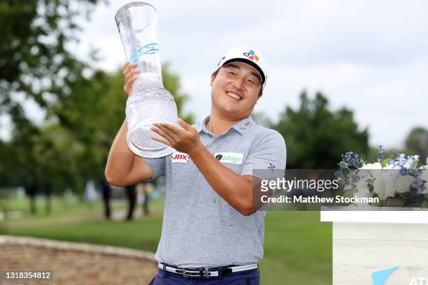Lee of South Korea celebrates with the trophy after winning the AT&T Byron Nelson at TPC Craig Ranch on May 16, 2021 in McKinney, Texas. Lee won the...